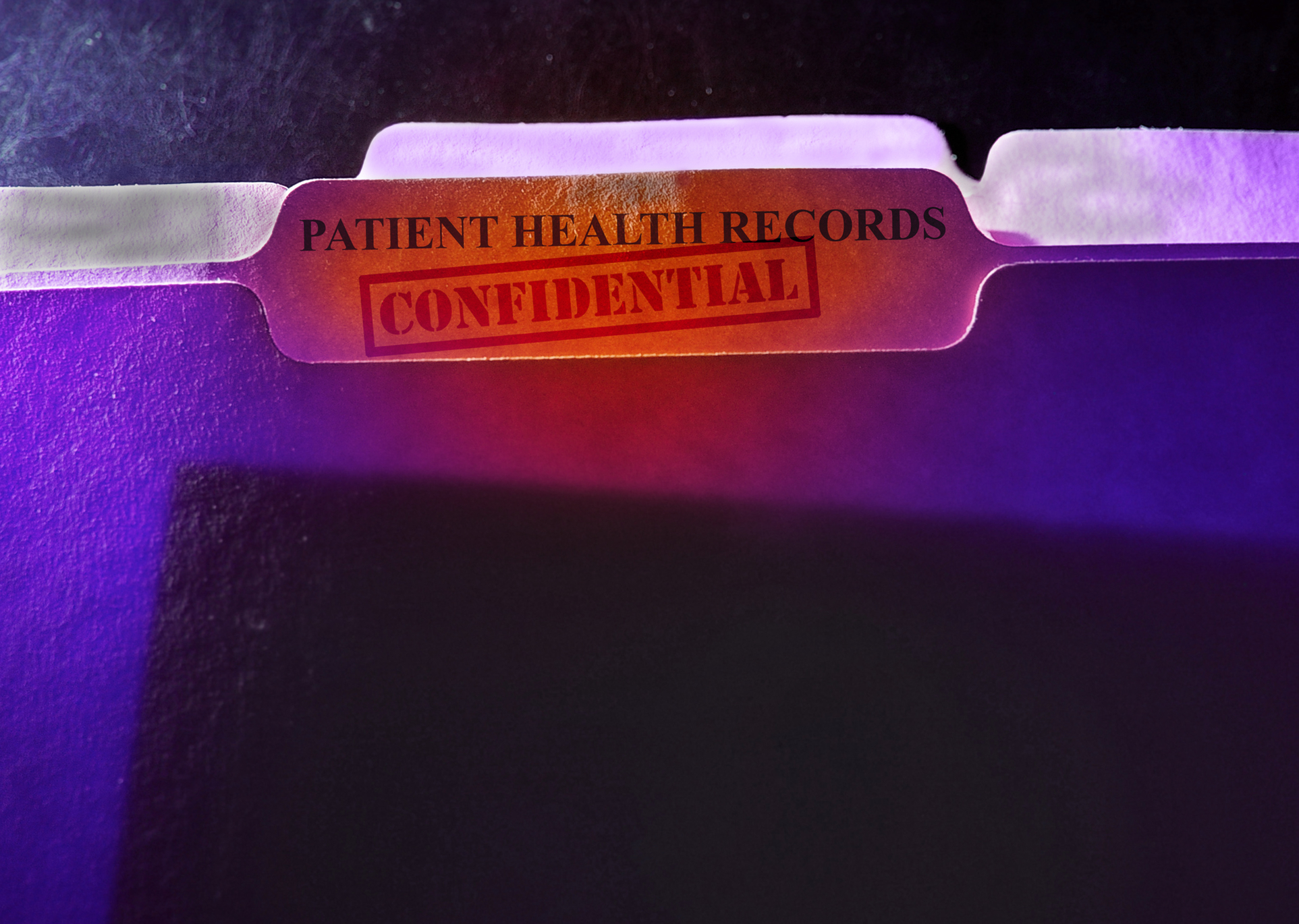 Patient Health Records folder with Confidential stamp Confidential patient health records folder